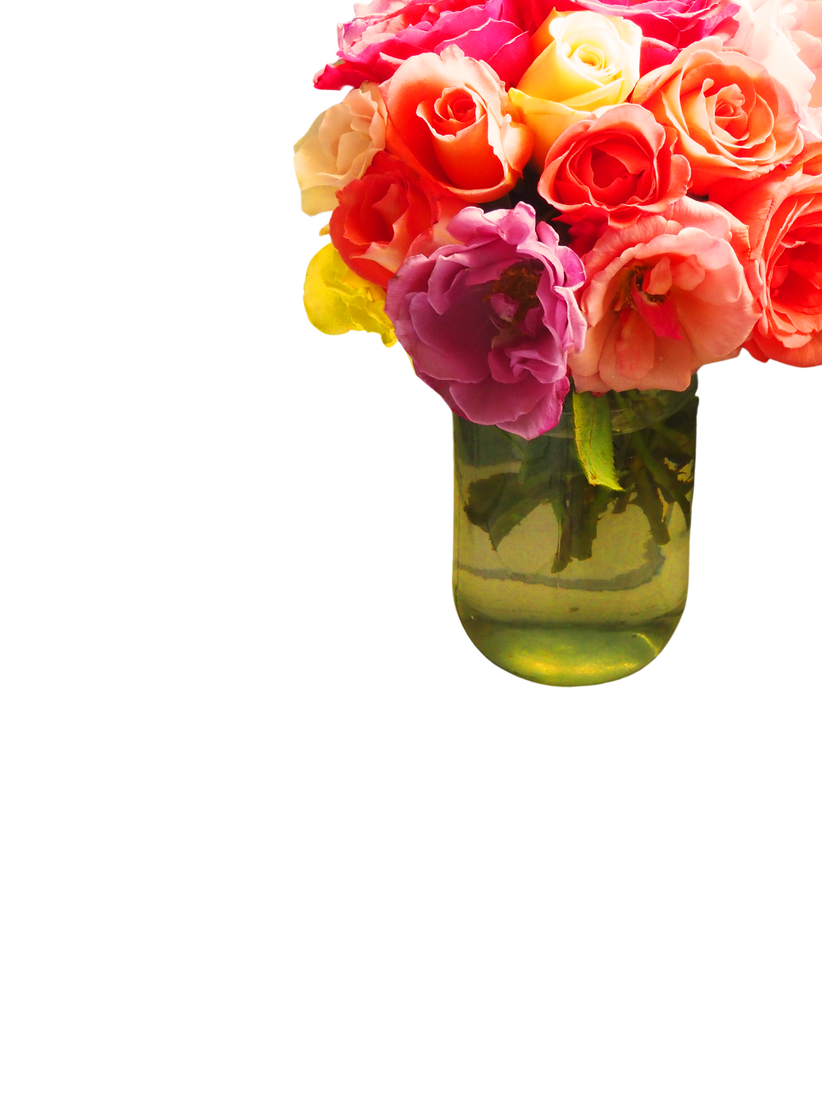 Assorted-color Flower Arrangement in Clear Glass Vase Beside a Laptop