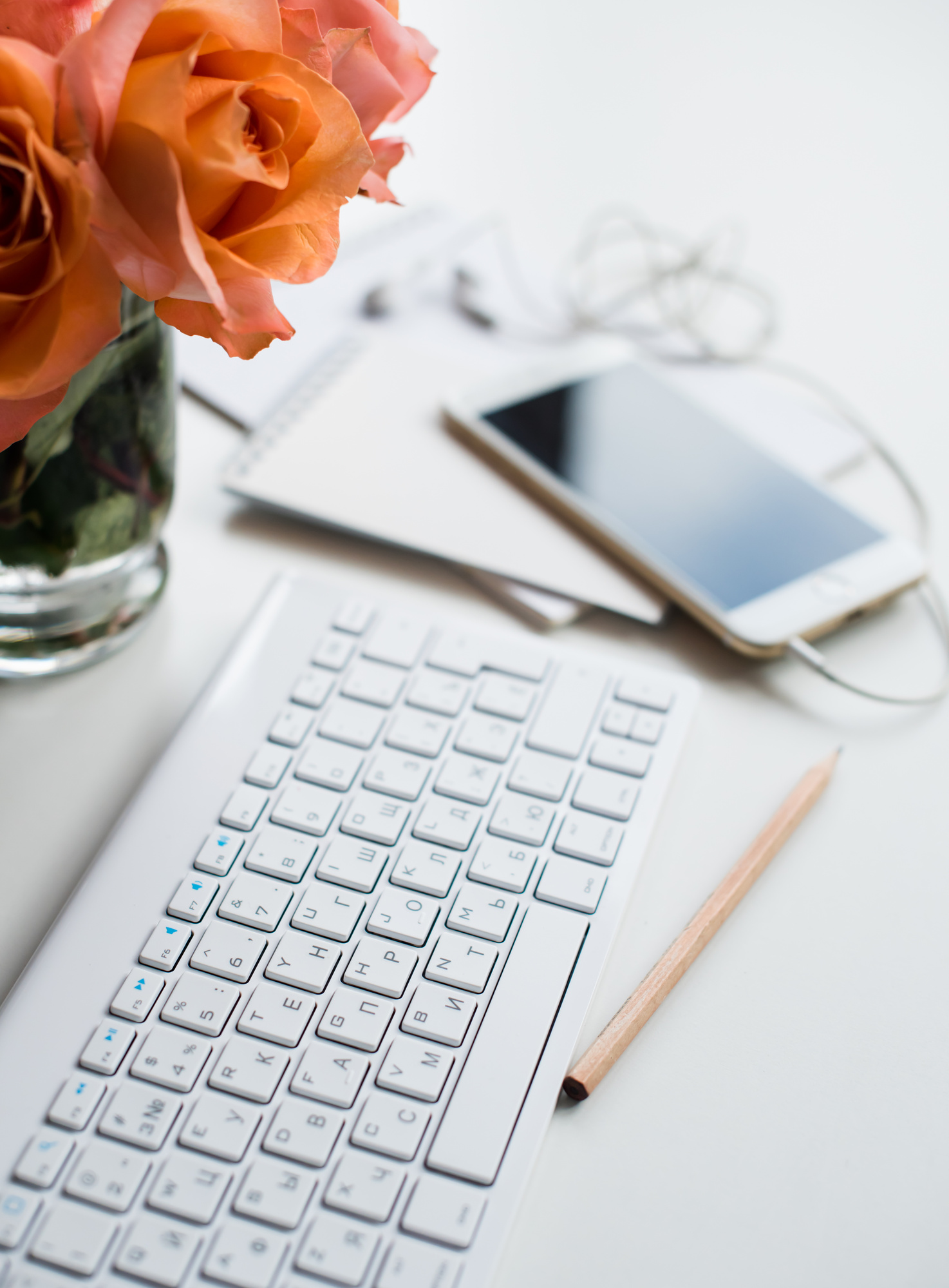 Jennifer Tunmer, freelance social media manager, specializing in social media management, content curation, and content creation for small businesses and nonprofit organizations. Image of roses and a keyboard.